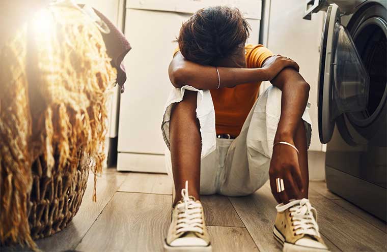 Youth depressed with head down - Hale Opio news article
